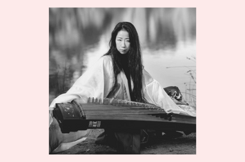 Artist Mindy Meng Wang and her Guzheng a traditional Chinese stringed harp-like instrument 